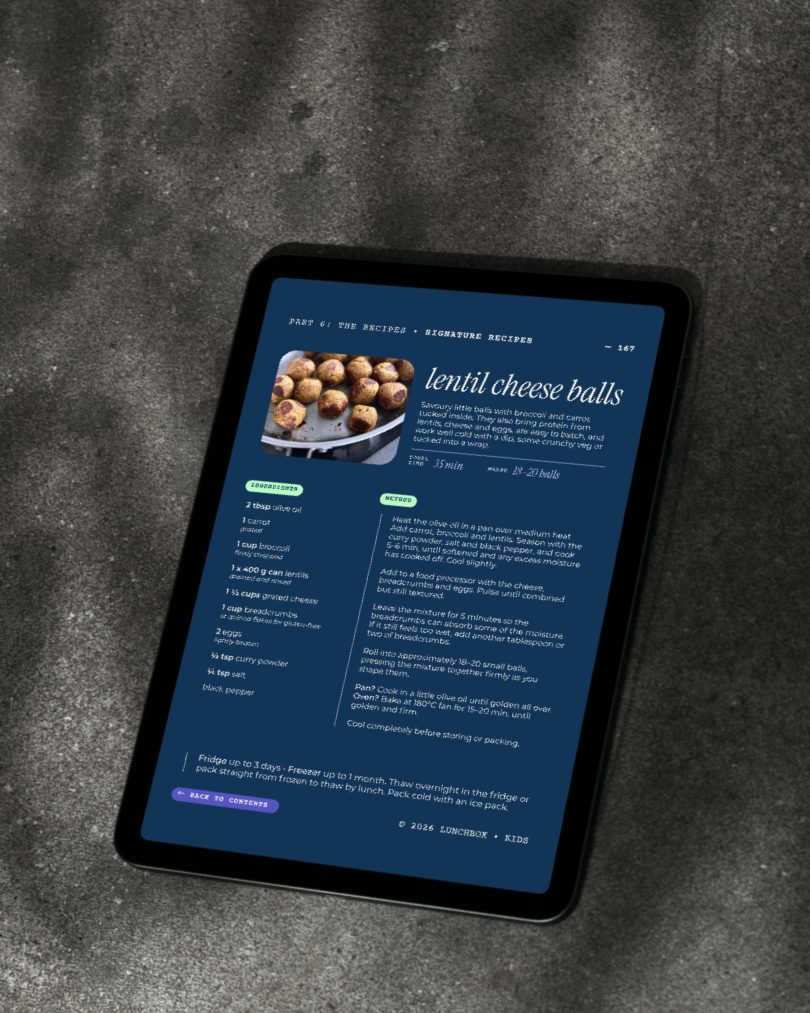 A tablet showing page 167, lentil cheese balls recipe, on a concrete surface