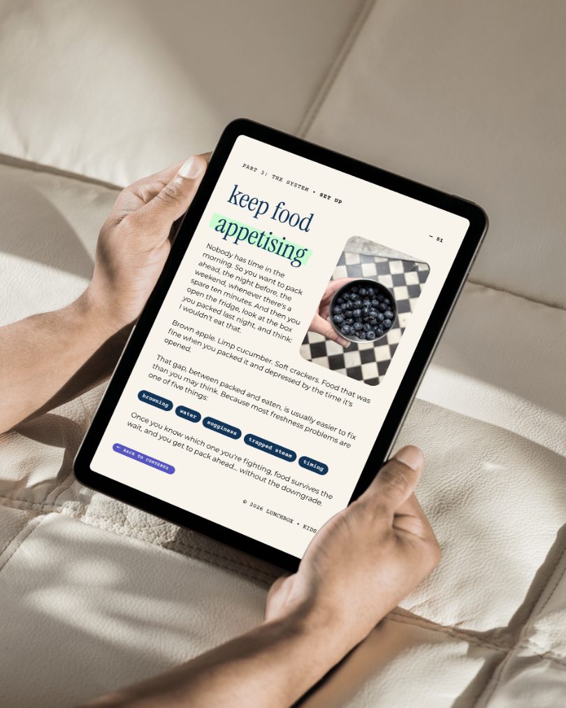 Hands holding a tablet showing page 51, keep food appetising